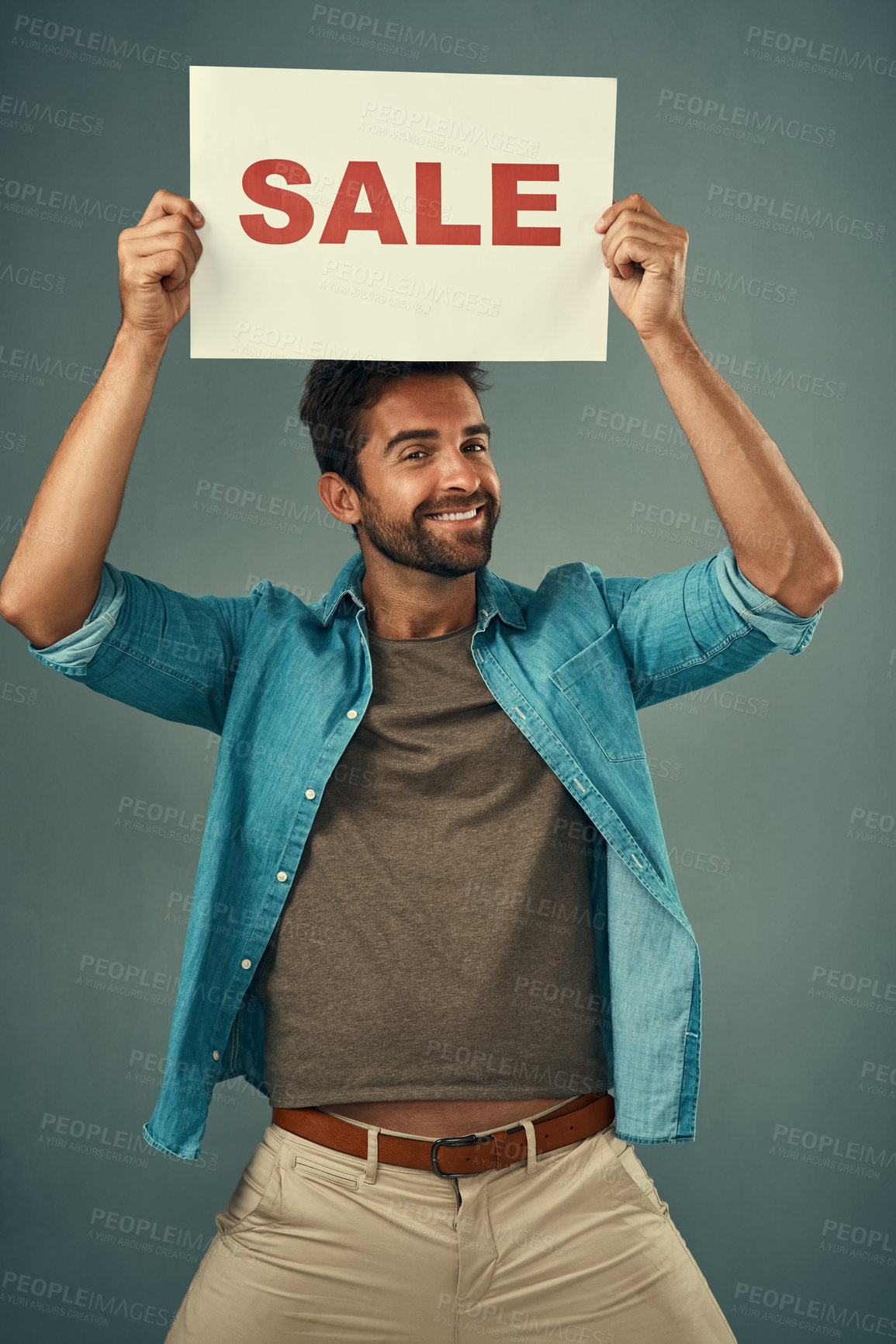 Buy stock photo Happy man, sale and billboard poster for advertising, marketing or branding against a grey studio background. Male person or realtor holding board or sign for sales announcement or advertisement