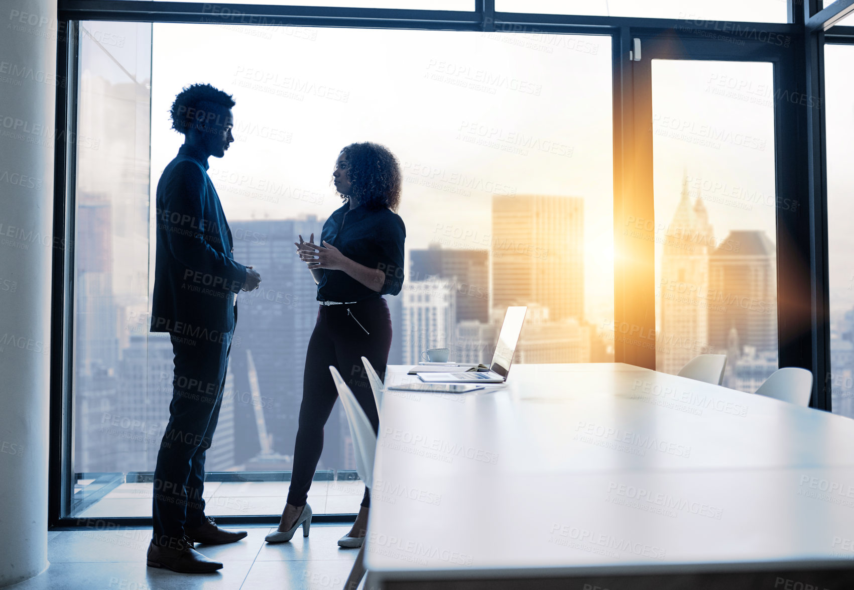 Buy stock photo Shot of two businesspeople having a discussion in an office