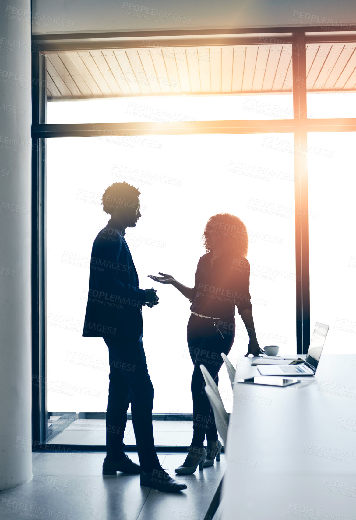 Buy stock photo Shot of two businesspeople having a discussion in an office