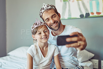 Buy stock photo Man, girl child and selfie in princess tiara, happiness with love and care at family home. Smile in picture, father and daughter bonding with crown, happy people spending time together in bedroom