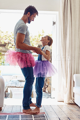 Buy stock photo Young girl on man feet, ballet dancing and fun with learning at home in tutu, bond with love and creativity. Family, father and daughter dance in living room, ballerina lesson and time together