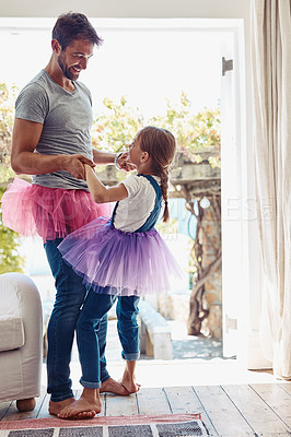 Buy stock photo Daughter on father feet, ballet dancing and fun with learning at home in tutu, bond with love and creativity. Family, man and girl dance in living room, ballerina lesson and spending time together