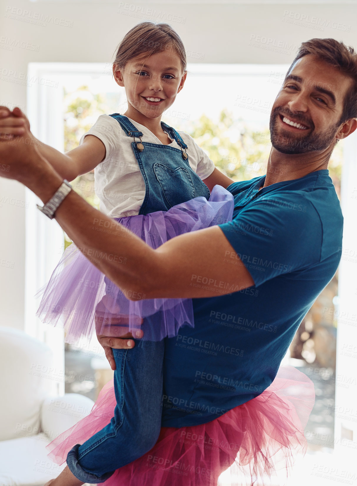 Buy stock photo Shot of a father and daughter dancing in their tutus