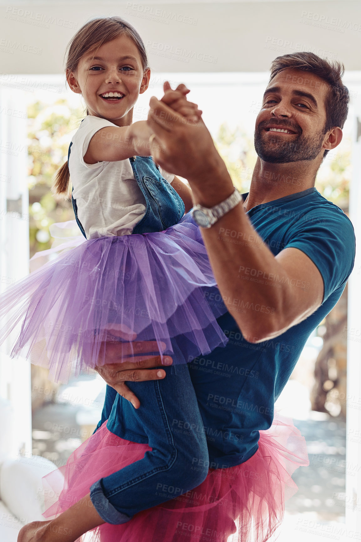 Buy stock photo Shot of a father and daughter dancing in their tutus