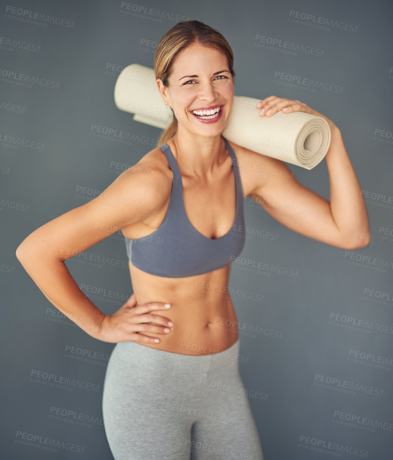 Buy stock photo Fitness, exercise and woman with yoga mat, portrait and confident girl on grey studio background. Proud, healthy person and model with challenge, progress and training for wellness, smile and balance
