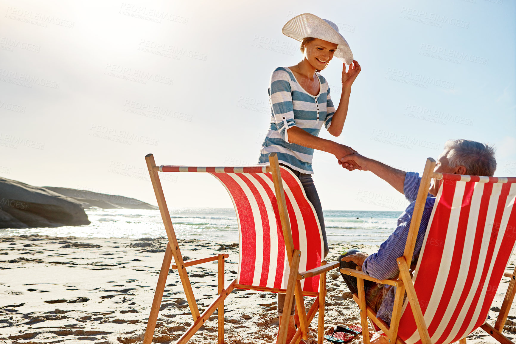 Buy stock photo Shot of a mature couple spending the day at the beach