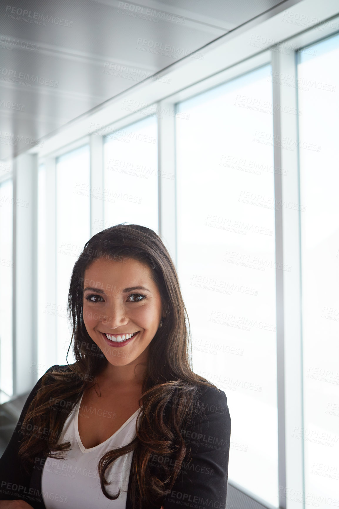 Buy stock photo Portrait of a smiling businesswoman posing in an airport terminal