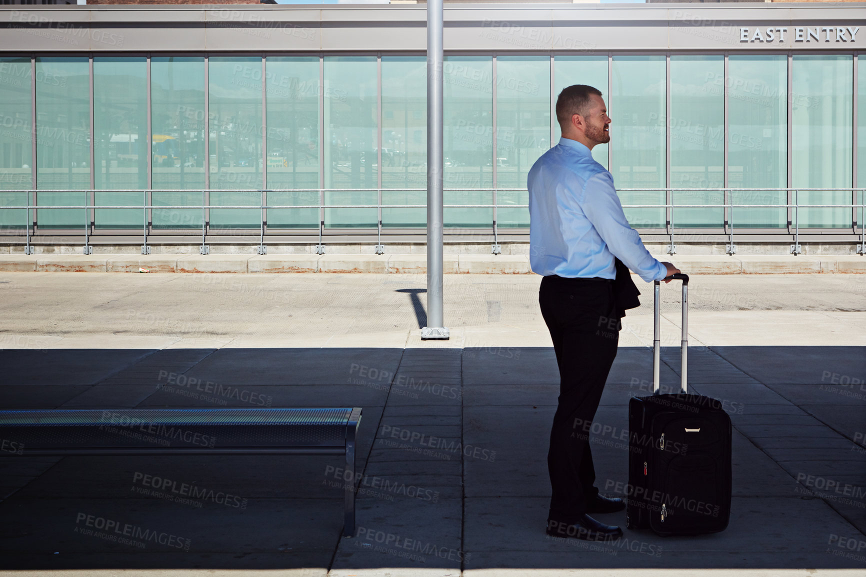Buy stock photo Shot of a professional businessman waiting for transportation outside an airport