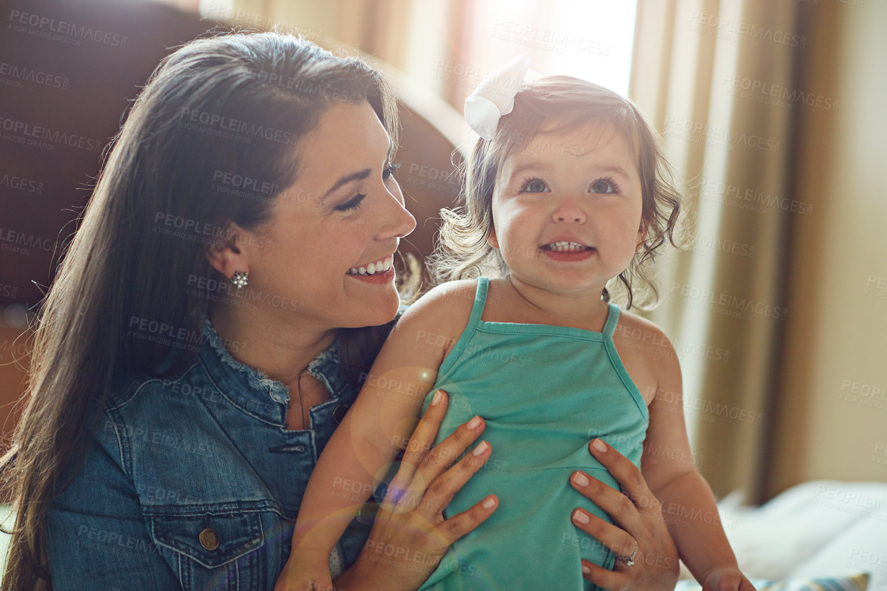 Buy stock photo Mom, baby and happy family for bonding, playing and love or support at home in living room. Excited child, daughter or kid with woman for mothers day and relax in lens flare for holiday and care