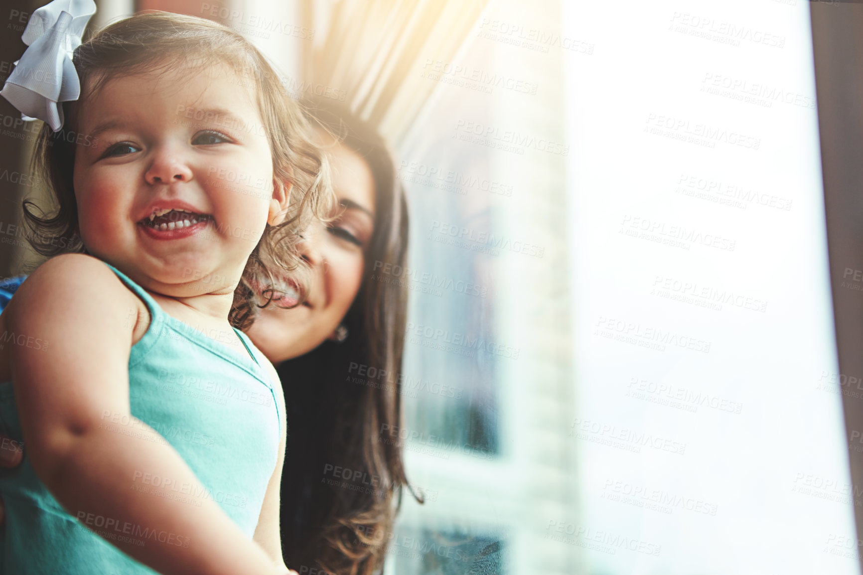 Buy stock photo Cropped shot of a mother bonding with her adorable little daughter at home