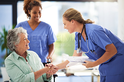 Buy stock photo Handshake, nurse smile and senior woman in wheelchair with medical results and surgery success news. Hospital, healthcare and clinic with women and nursing staff with care and help of elderly person
