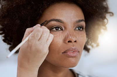 Buy stock photo Cropped shot of an attractive young woman having her makeup done