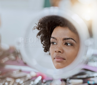 Buy stock photo Cropped shot of a reflection of an attractive young woman while her makeup gets done