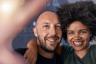 Buy stock photo Shot of a loving couple bonding at home smiling and looking happy