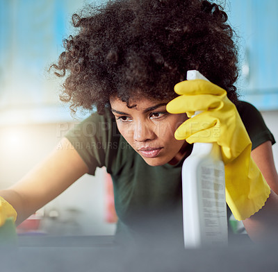 Buy stock photo Cropped shot of an attractive young woman with yellow gloves cleaning her home