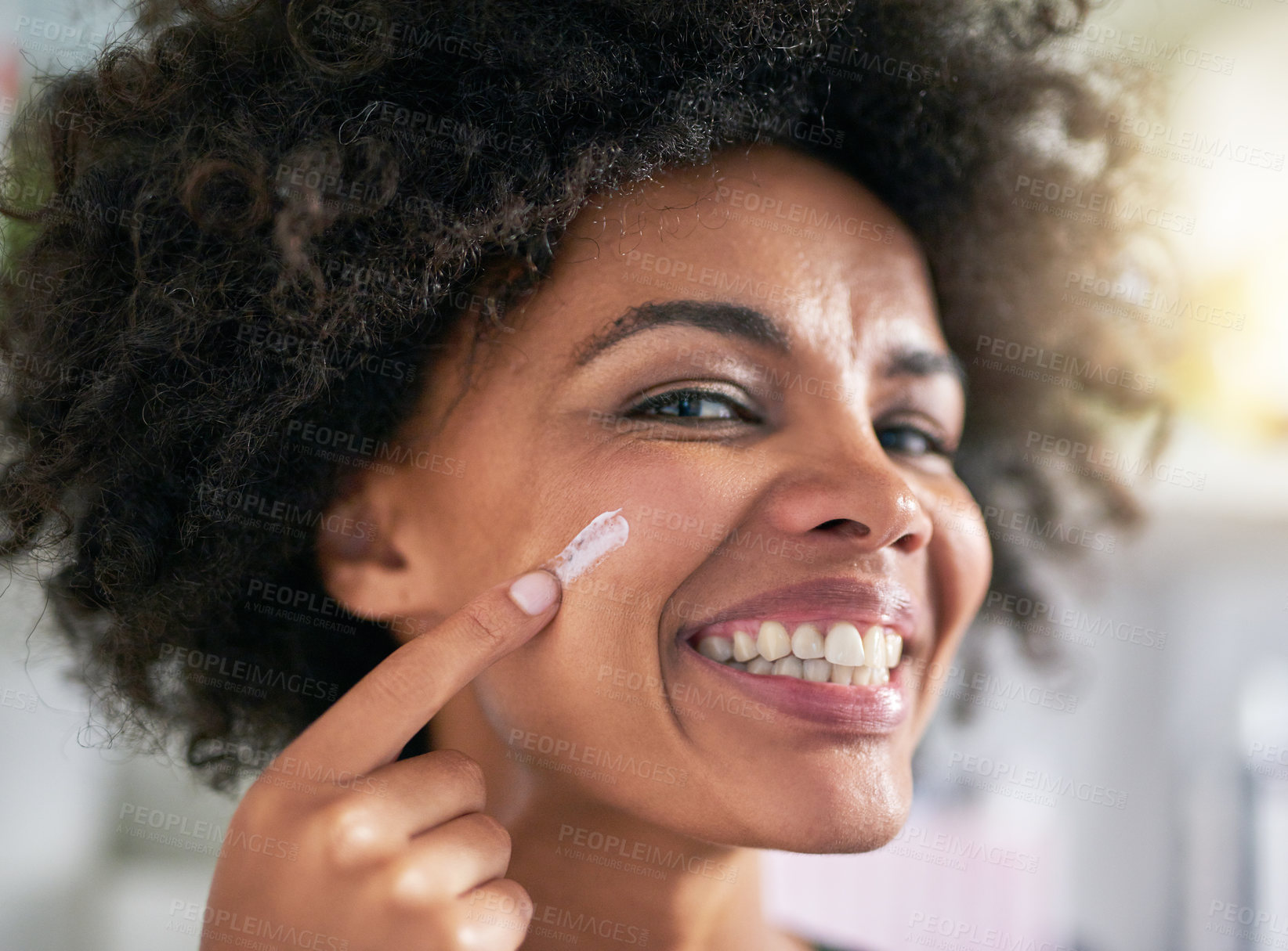 Buy stock photo Portrait, woman and hand with moisturiser for skincare, treatment and facial in home. Black person, happy and smile for dermatology, result and hydration with collagen boost, lotion and sunscreen