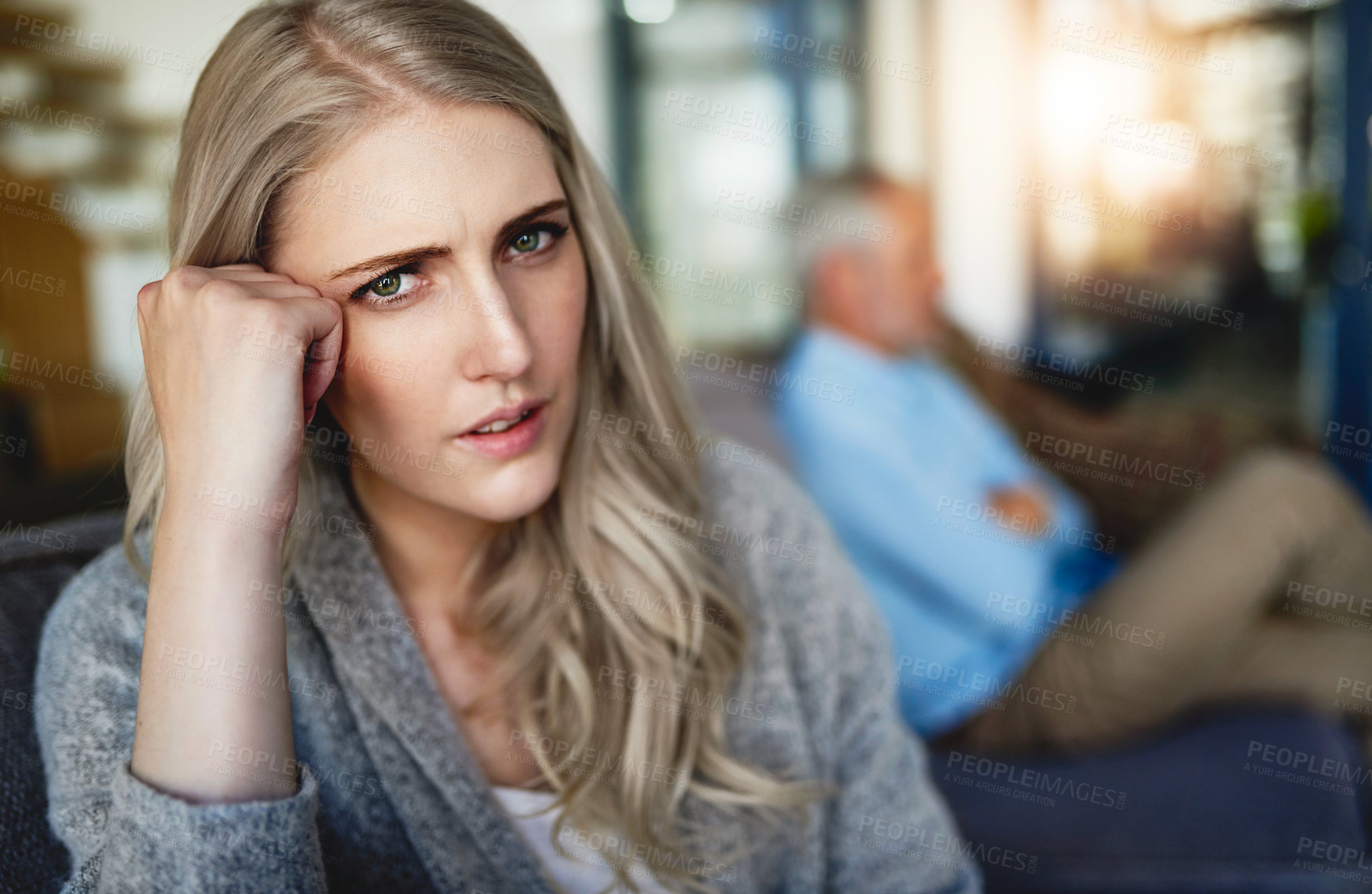 Buy stock photo Portrait of a woman looking despondent after having a fight with her husband at home