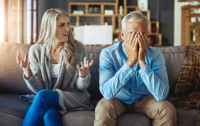 Buy stock photo Cropped shot of a couple having relationship problems at home