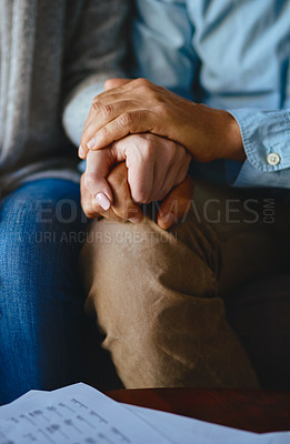 Buy stock photo Holding hands, senior couple and closeup of life insurance note with paperwork in living room. Home, sofa and elderly people with empathy, hope and trust with solidarity for bills problem in a lounge