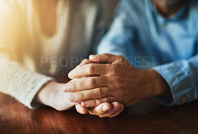 Buy stock photo Closeup shot of two unidentifiable people holding hands in comfort