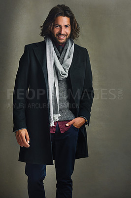 Buy stock photo Portrait of a stylishly dressed man posing against a gray background in the studio