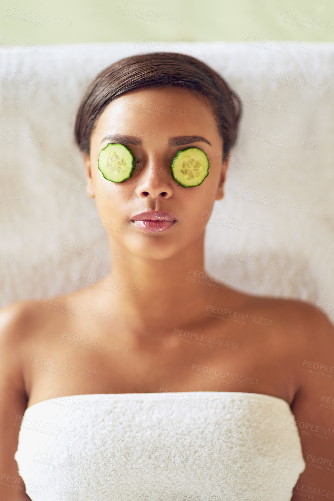 Buy stock photo Woman, spa and cucumber on face and relax, facial therapy and reduce puffy and dark circles. Resting, stress relief and calm for cosmetic beauty and wellness, soothing and natural or luxury treatment