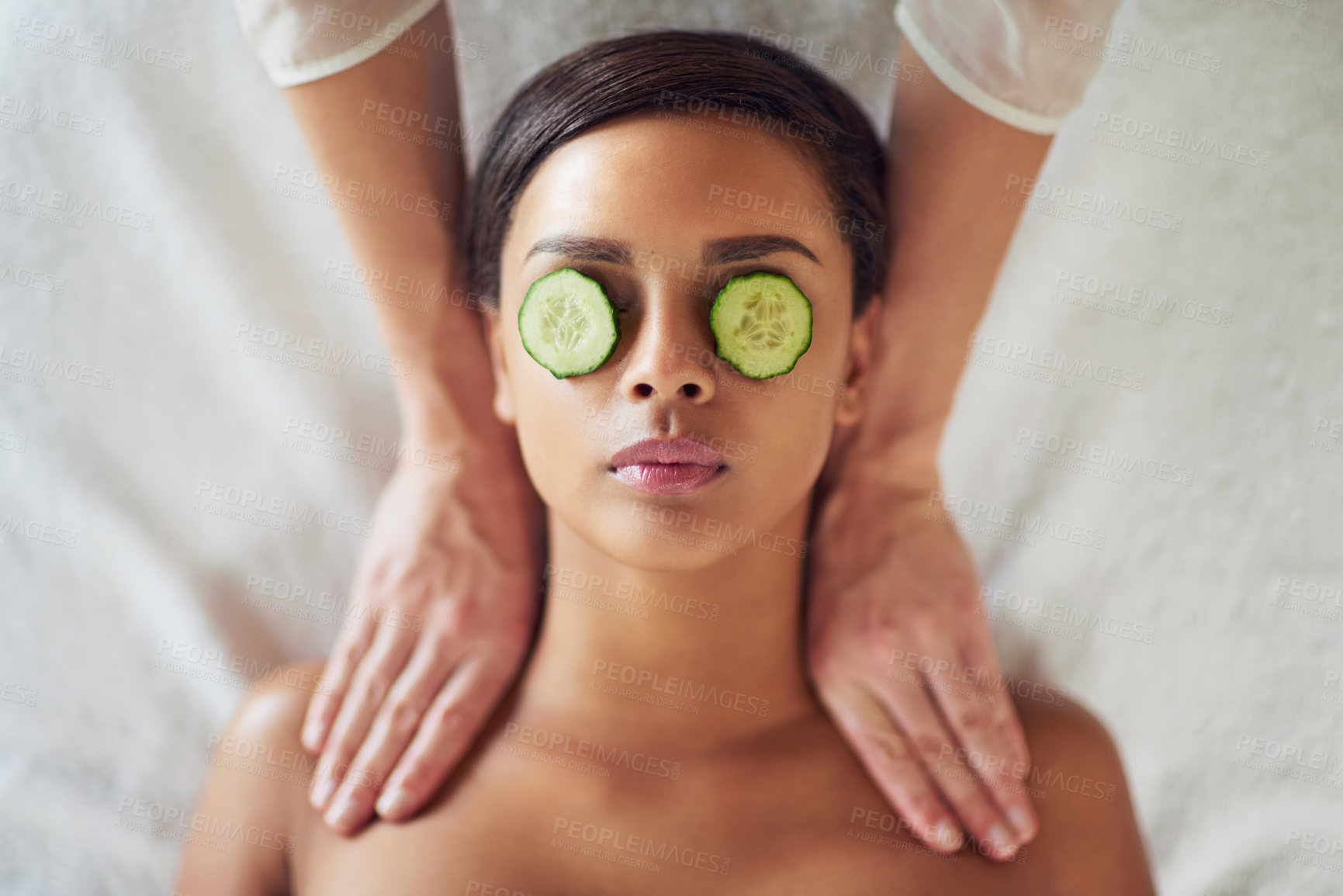 Buy stock photo Woman, spa and neck massage for relax, masseuse hands and cucumber for dark circles. Resting, stress relief and calm for cosmetic and wellness, soothing therapy and natural or luxury treatment