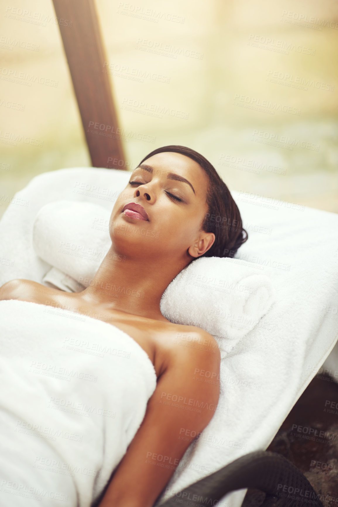 Buy stock photo Woman, spa and relax on bed for wellness in Thailand, detox and pamper for self care. Female person, beauty or healing in salon for calm or peace, eyes closed or skin care and natural on vacation