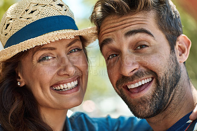Buy stock photo Portrait of a happy tourist couple enjoying the sunshine in a foreign city