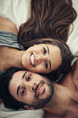 Buy stock photo Bonding, portrait and couple on bed in home for relaxing morning on weekend together from above. Happy, joy and top view of young man and woman resting in bedroom for love and connection at house.