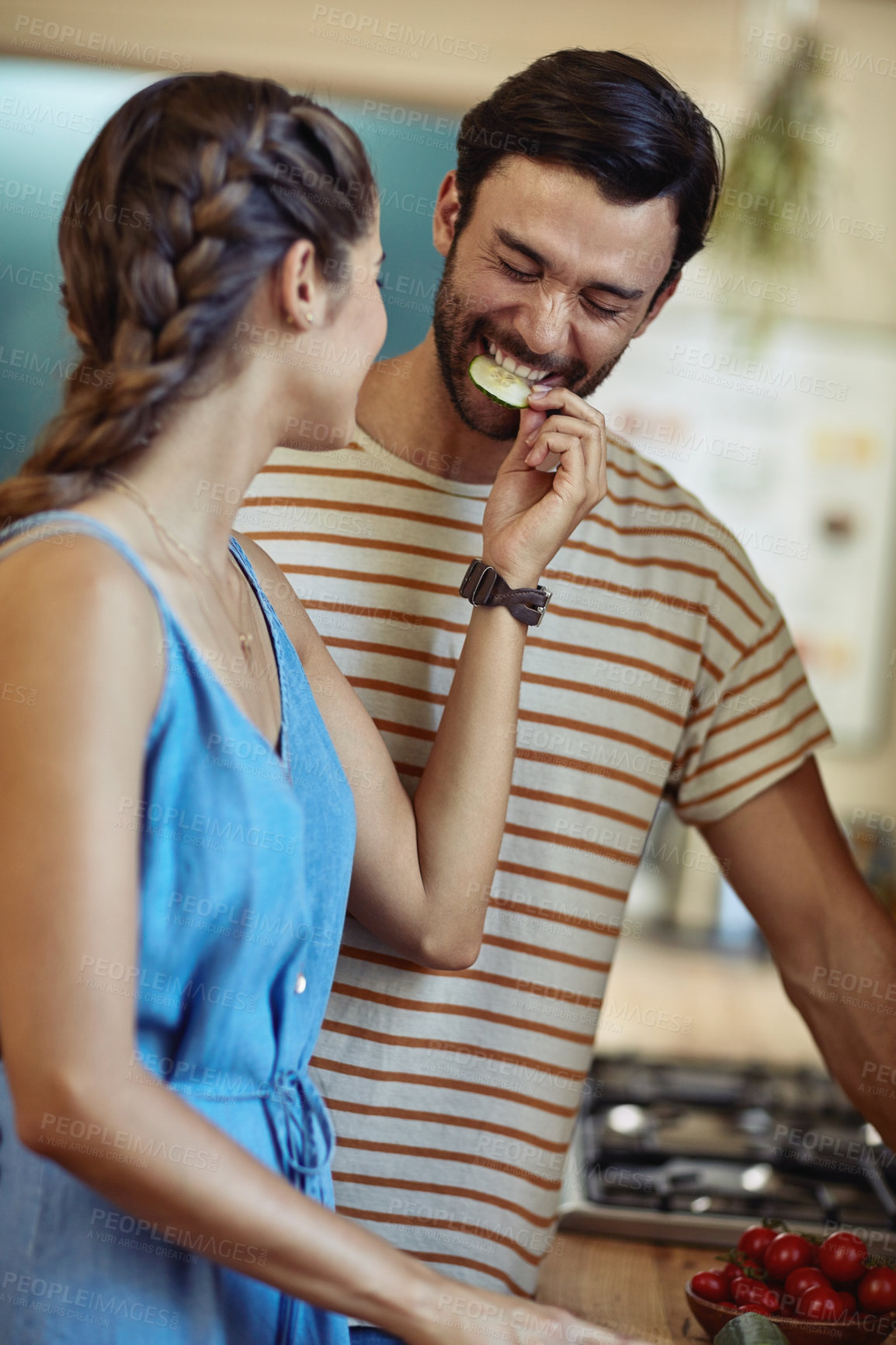 Buy stock photo Snack, love and couple in kitchen, smile and romance for anniversary in house, date and together in morning. Commitment, man and woman with food, eating and feeding in home, happy and calm in weekend