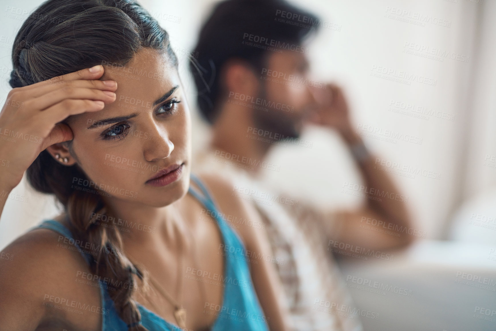 Buy stock photo Unhappy, upset or sad with a couple arguing on a sofa in their home living room about an affair or breakup. Depression, abuse or domestic violence with a woman thinking about divorce after a fight