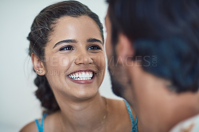 Buy stock photo Home, couple an happy with bonding for love with trust, care and support with funny conversation. People, relationship and smile with discussion or joke as lovers for laughing and stress relief