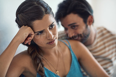Buy stock photo Conflict, upset or sad with a couple arguing on a sofa in their home living room about an affair or breakup. Depression, unhappy or domestic violence with a woman thinking about divorce after a fight