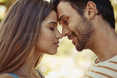 Buy stock photo Outdoor, couple and happy with forehead touch in park for bonding, love and affection in Spain. People, relationship and smile for support with care as lovers on break to relax, rest and embrace