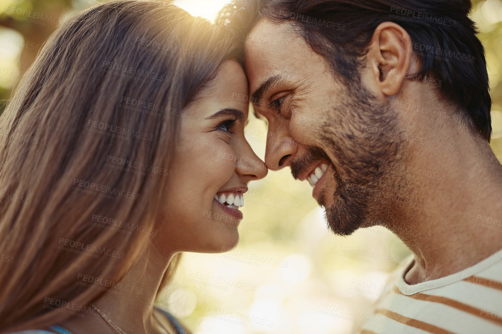 Buy stock photo Happy, couple and forehead touch in outdoor with love, affection and soul connection with joy for commitment. Man, woman and together in garden on vacation for anniversary, bonding and relationship.