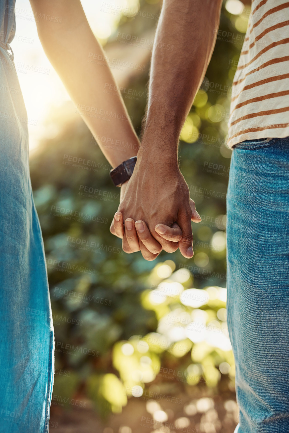 Buy stock photo Couple, walking and holding hands in park in closeup for love, relationship and romance on weekend. Man, woman and intimate in garden during summer for support, care and trust together while on date