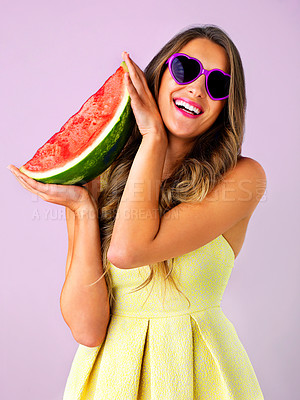 Buy stock photo Studio shot of a beautiful woman holding a watermelon against a pink background