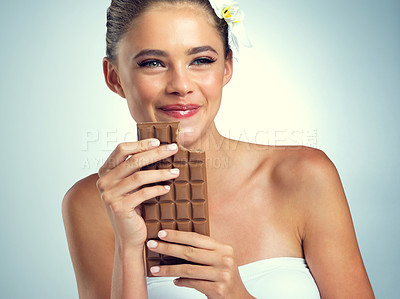 Buy stock photo Studio, smile and woman with chocolate for eating, snack and dessert for female person. Happiness, girl and sweets for mood enhance, candy and cognitive benefits for memory by gray background