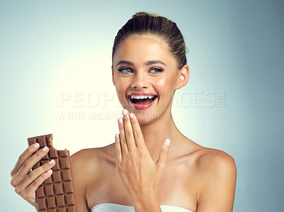 Buy stock photo Studio, thinking and woman with chocolate for eating, snack and dessert for female person. Happiness, girl and sweets for mood enhance, candy and cognitive benefits for memory by gray background