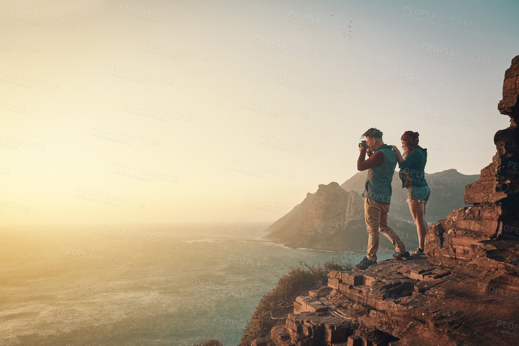 Buy stock photo Hiking, photography and couple on mountain for love, landscape and adventure or travel. Tourists, woman and man in nature or countryside for vacation together with camera in morning for memory 