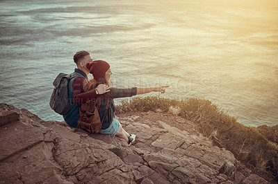 Buy stock photo Happy, couple and pointing on mountain at ocean on vacation, holiday or travel together. Man, woman and sightseeing at cliff at sea for adventure, journey or hiking outdoor for back view of water