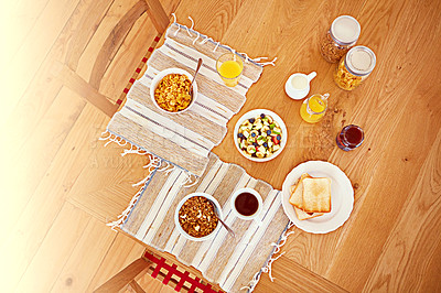 Buy stock photo High angle shot of an empty table set with breakfast foods