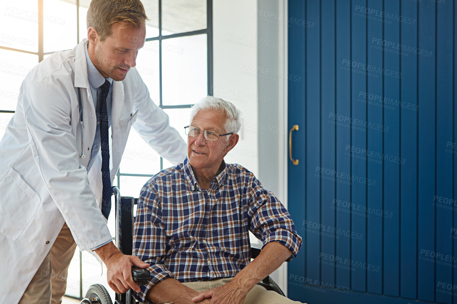 Buy stock photo Cropped shot of a male doctor talking to a senior patient in the retirement home