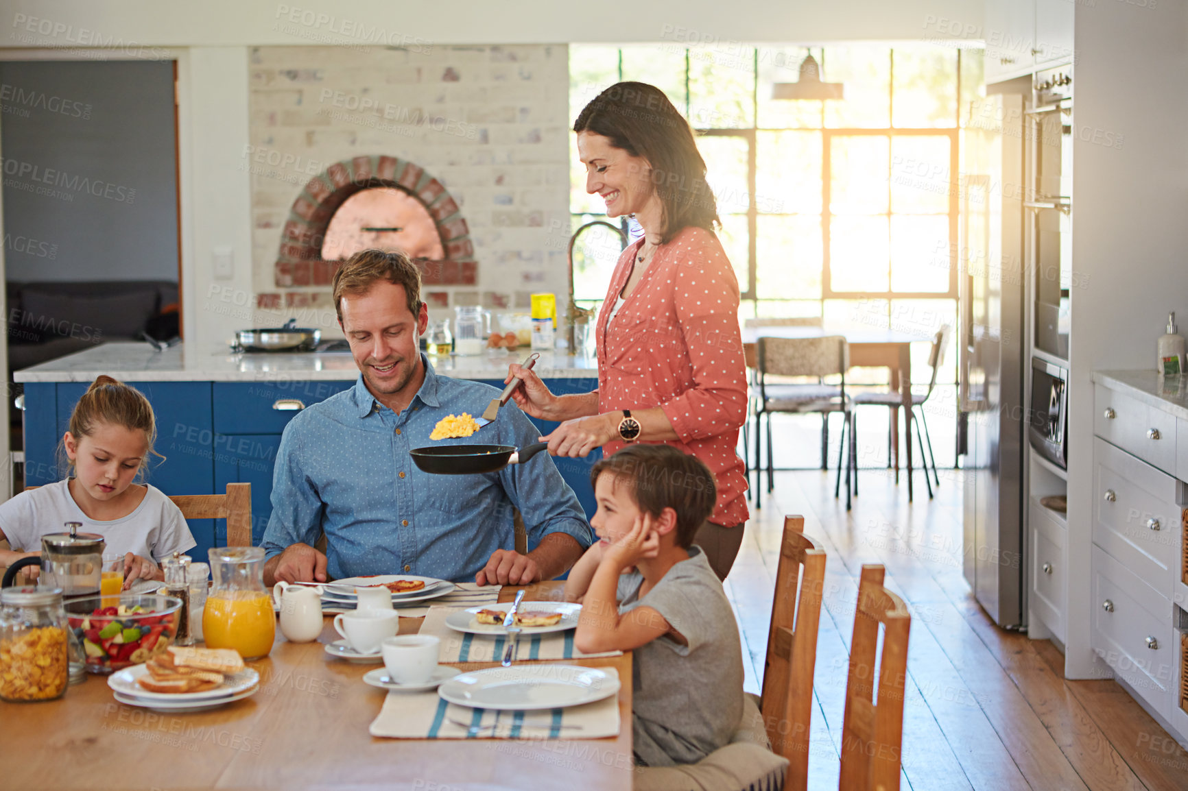 Buy stock photo Breakfast, eggs and morning with a family in the dining room of their home together for health or nutrition. Mom, dad and sibling children eating food at a table in the apartment for love or bonding