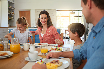 Buy stock photo Smile, food and morning with a family in the dining room of their home together for health or nutrition. Mother, father and happy sibling kids eating breakfast at a table in an apartment for bonding