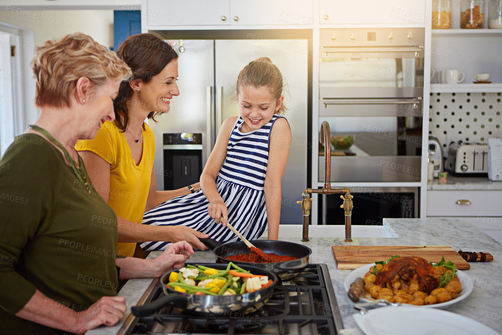 Buy stock photo Grandmother, mother and daughter cooking together with teaching, learning and happy bonding in home. Food, women and girl in kitchen for lunch with support, love and sharing healthy recipe on counter