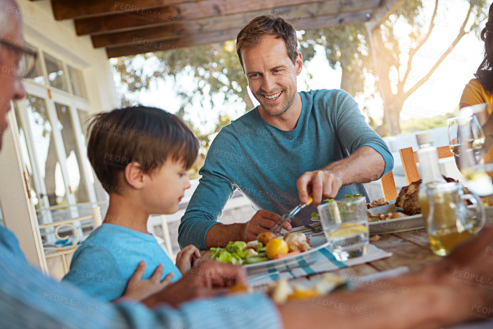 Buy stock photo Family, father and child with food for lunch, supper and dinner meal at home together. Celebration, parents and children with dish for bonding, relax and eating for nutrition, health and wellness