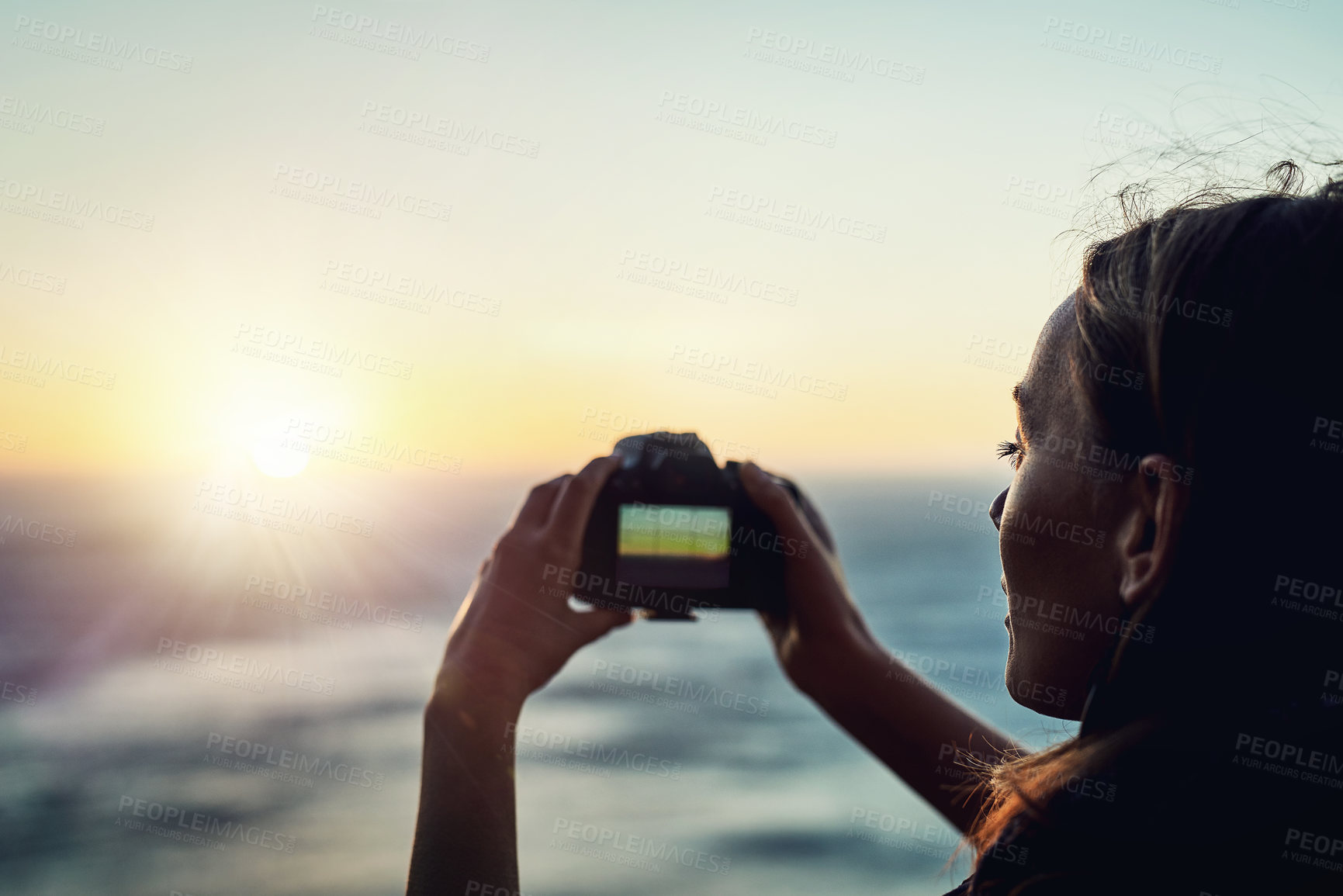 Buy stock photo Beach, sunset or woman with camera in nature for photography, memory or scenic capture on summer, trip or vacation. Lens, sea or girl with digital photo of ocean, water or sunrise travel moment