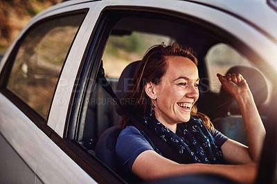 Buy stock photo Cropped shot of a young woman driving in her car